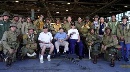 World War II veterans Eugene Leavy, center left,
