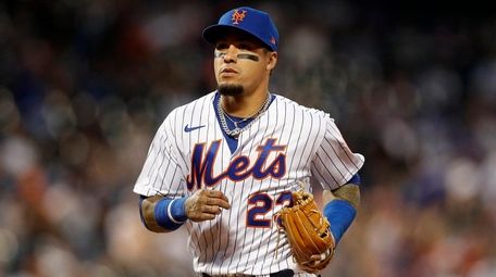 Javier Baez of the Mets runs to the