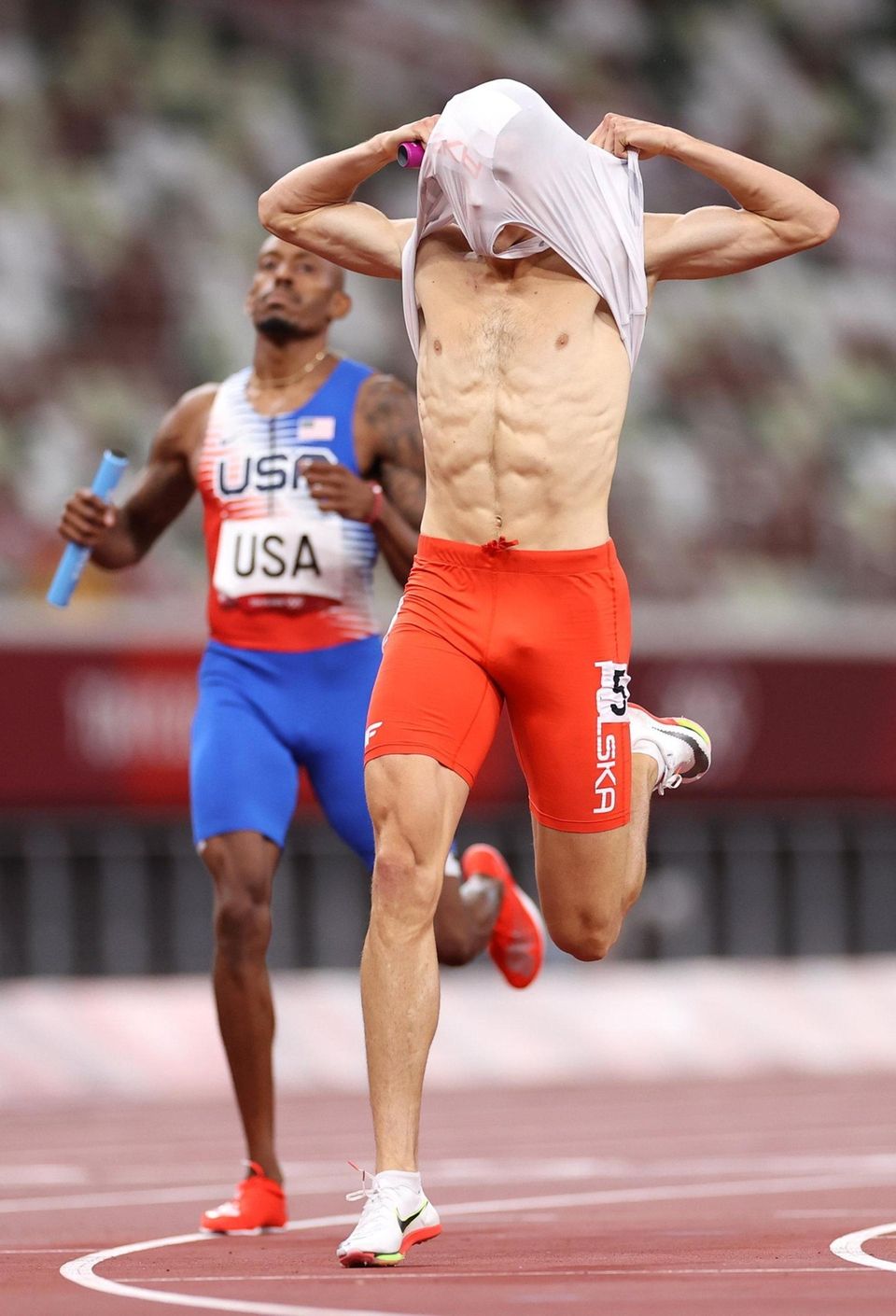 Kajetan Duszynski of Team Poland celebrates after crossing