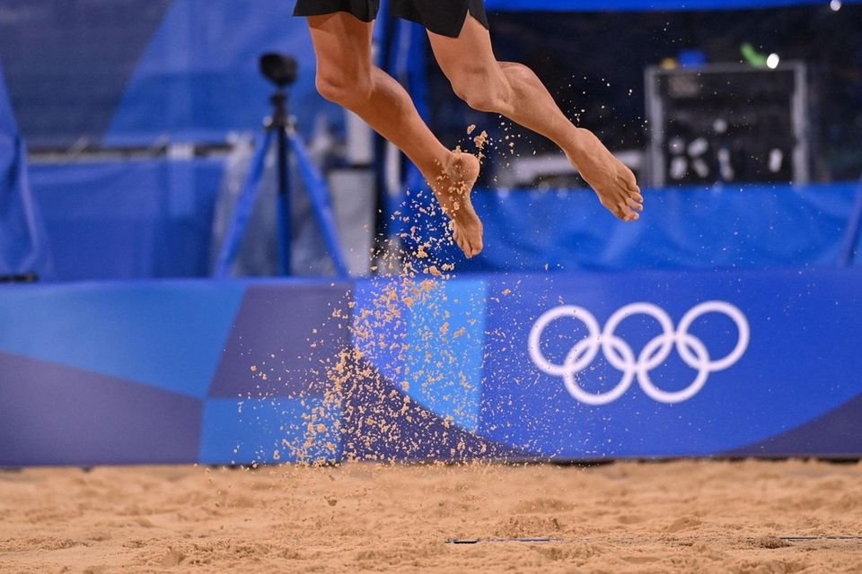Sand falls to the ground as USA's Jacob