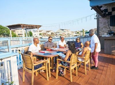 Chef/owner Bibi Bethune chats with patrons, Caribbean Island,