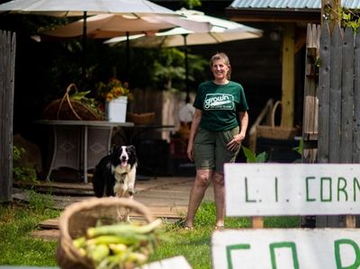 Meghan Bush at her farm stand, Meghan's Munchies.