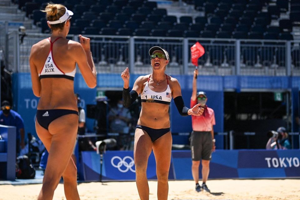 USA's April Ross (R) gestures to partner Alix