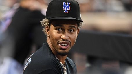 The Mets' Francisco Lindor looks on from