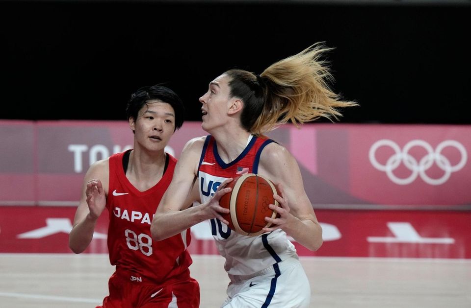 United States' Breanna Stewart (10) drives past Japan's