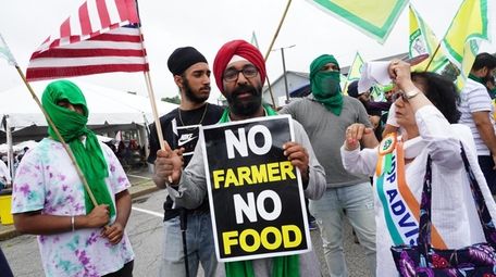 Satbir Singh, of Syosset, center, protests the Indian