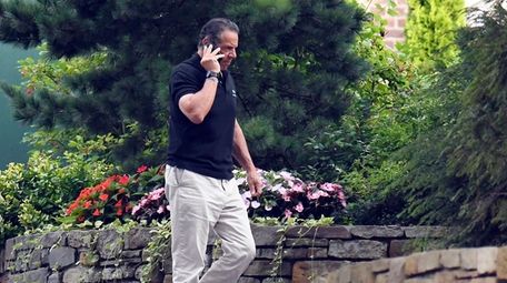 Gov. Andrew M. Cuomo talks on the phone