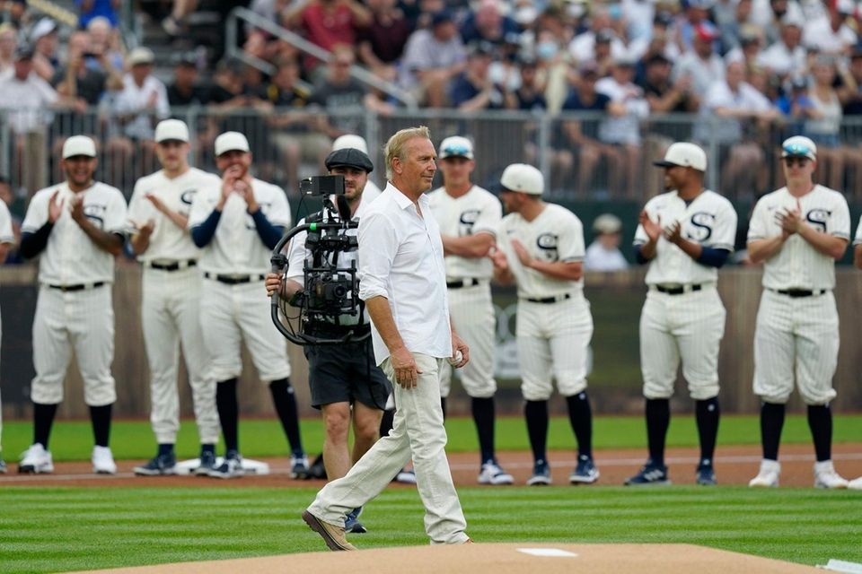 Actor Kevin Costner walks to the stands before