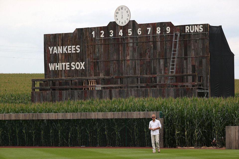 Actor Kevin Costner walks onto the field prior