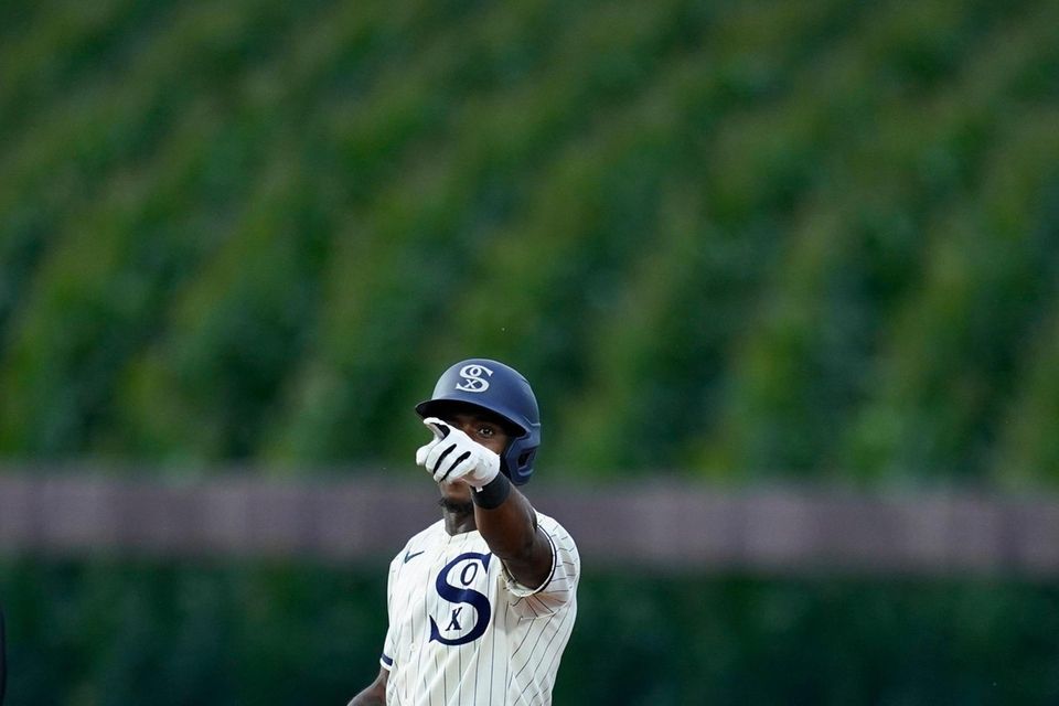 Chicago White's Tim Anderson points to the dugout