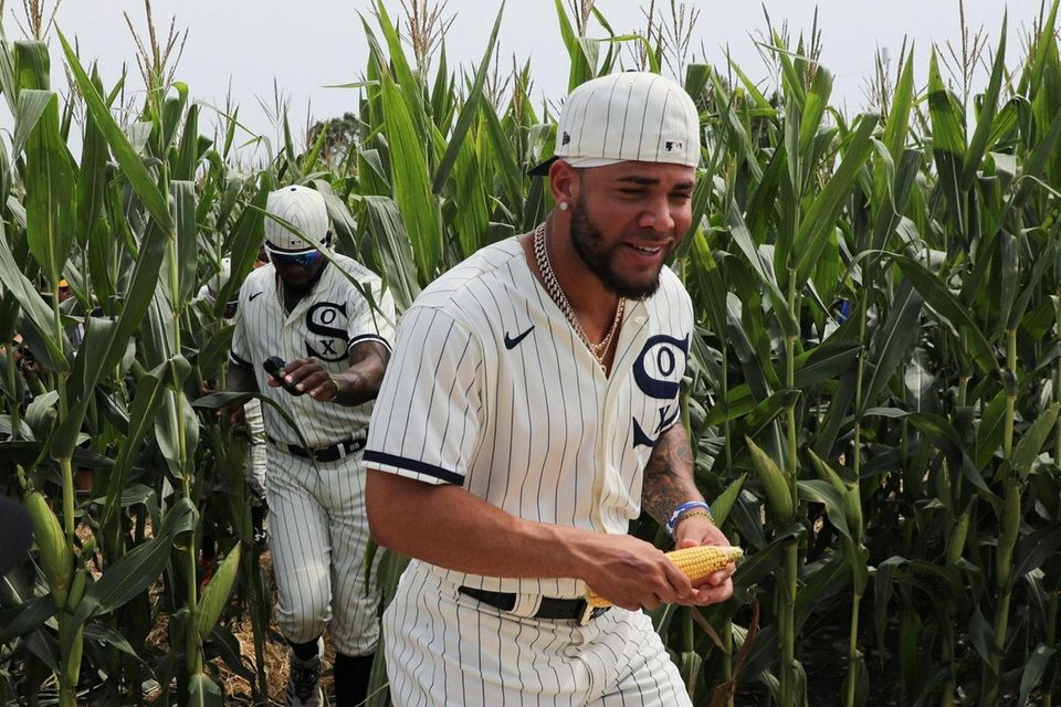 White Sox third baseman Yoan Moncada, right, holds