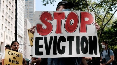 Activists hold a protest against evictions near City