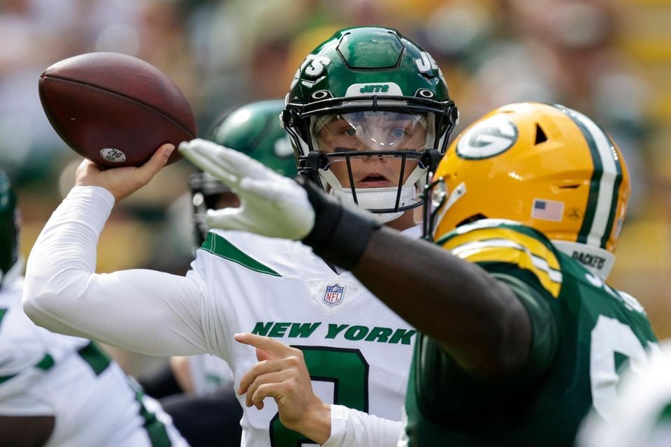 The Jets' Zach Wilson throws during the first