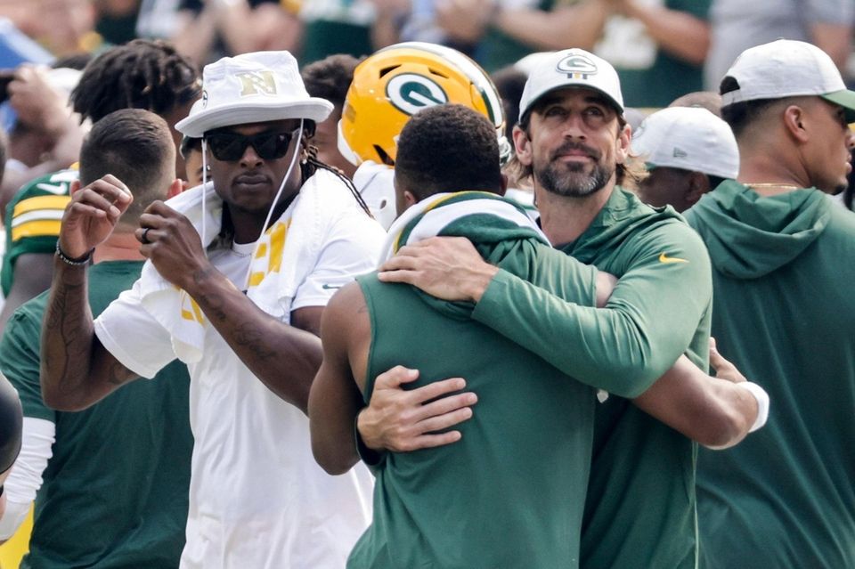 Green Bay Packers' Aaron Rodgers hugs Randall Cobb
