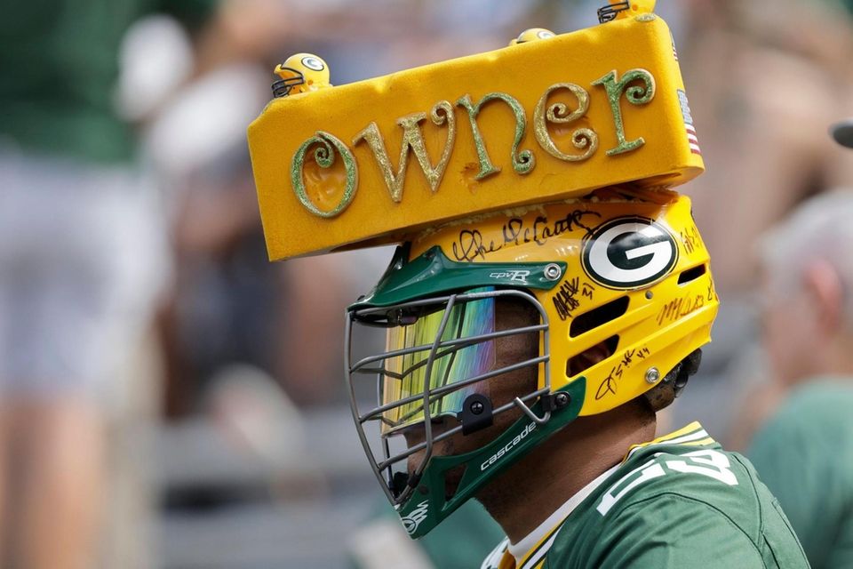 A fan watches during the first half of