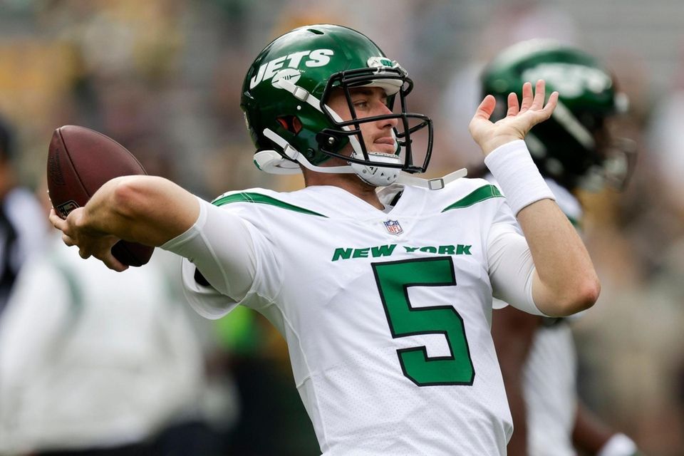 New York Jets' Mike White warms up before