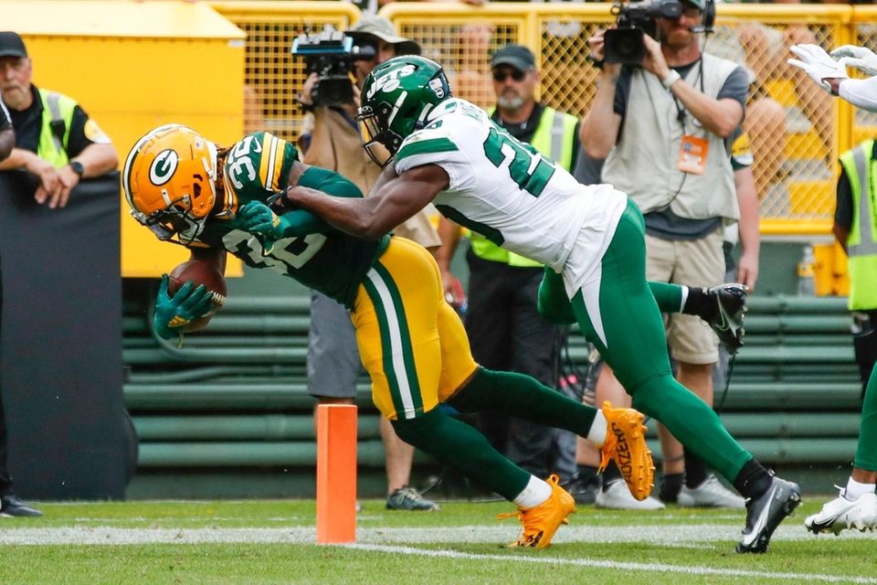 Green Bay Packers' Kylin Hill runs past New