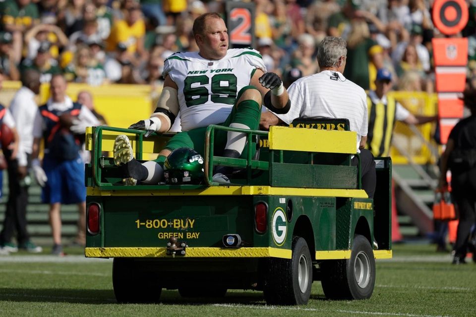 New York Jets' Conor McDermott is taken off