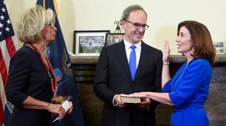 Kathy Hochul, right, is sworn in as the