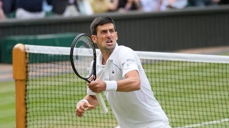 Serbia's Novak Djokovic celebrates after defeating Canada's Denis