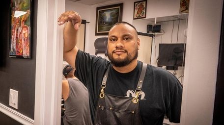 Andy Rodriguez, owner of Chupacabra Tattoo Inc. in