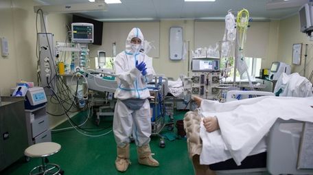 A medic wearing a special suit to protect