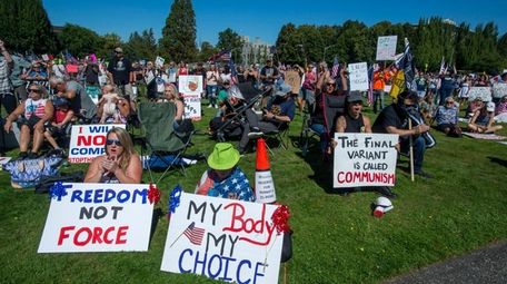 Anti-vaxxers protest Gov. Jay Inslee's vaccine mandate for