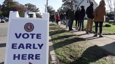 People line up to vote early at the