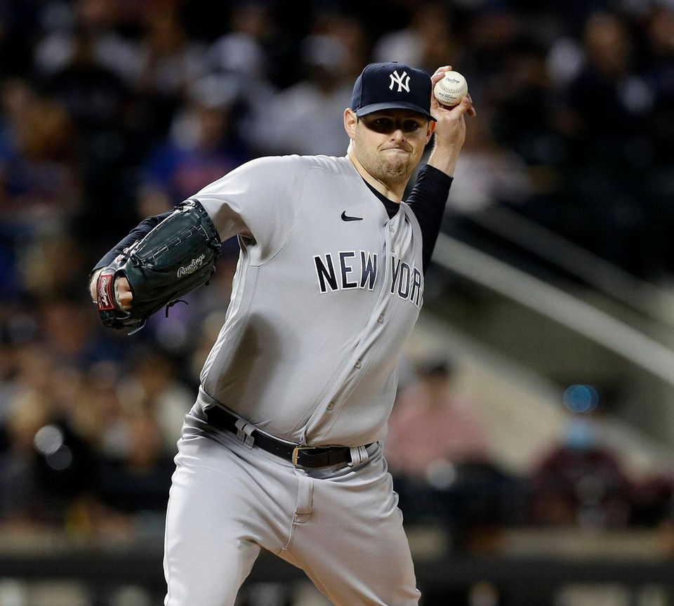 Jordan Montgomery of the Yankees throws to first
