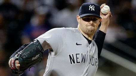 Jordan Montgomery of the Yankees throws to first
