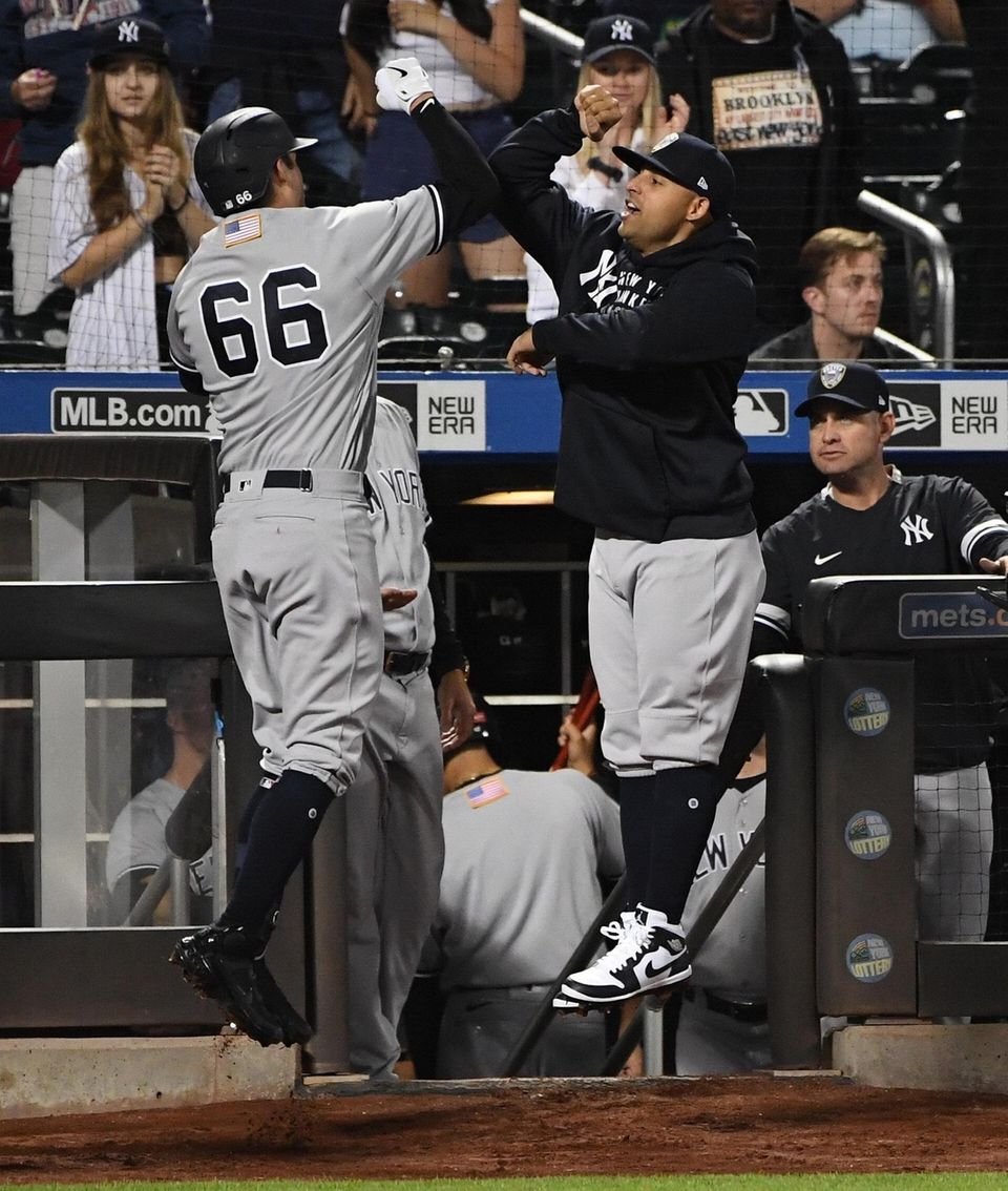 New York Yankees catcher Kyle Higashioka is greeted