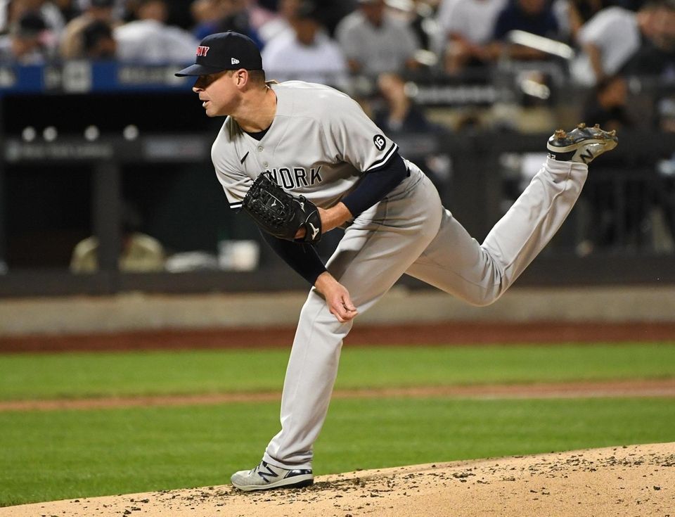 New York Yankees starting pitcher Corey Kluber delivers