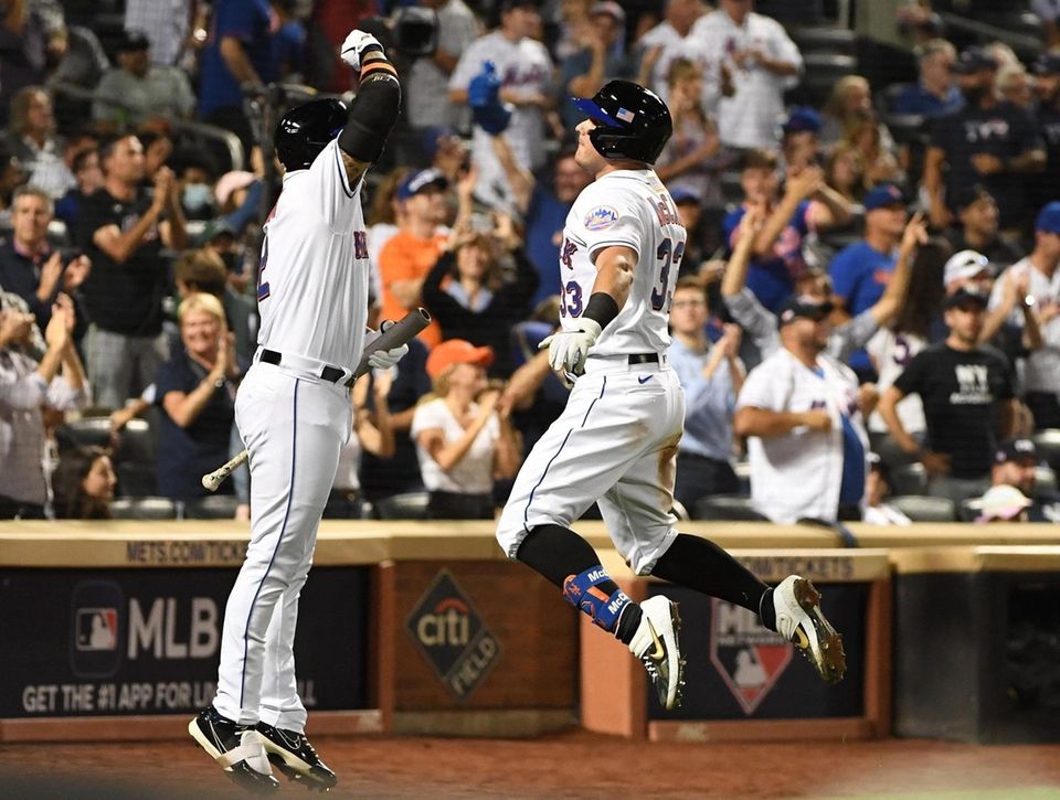 New York Mets catcher James McCann is greeted