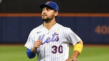Mets rightfielder Michael Conforto runs to the dugout