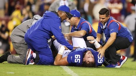 Nick Gates of the Giants exits the game