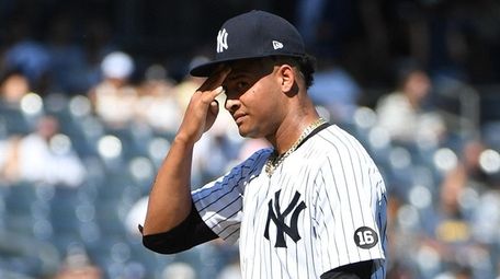 \Yankees starting pitcher Luis Gil reacts against Cleveland