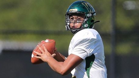 Ward Melville's Chris Prussen looks to pass in
