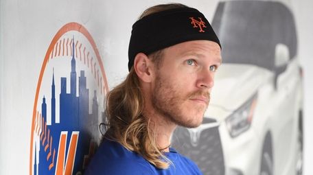 Mets pitcher Noah Syndergaard looks on from the