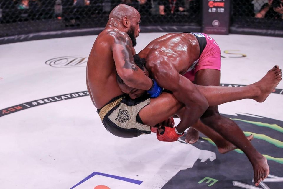 Phil Davis (pink shorts) shoots in for a