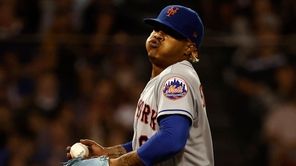 Mets pitcher Marcus Stroman exhales after giving up