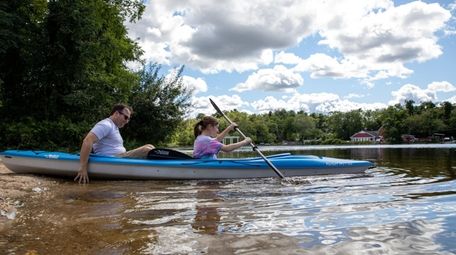 Rick Caskey and Abby Caskey, 13, enjoy kayaking