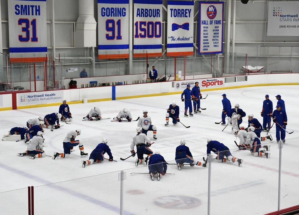 New York Islanders players stretch during training camp