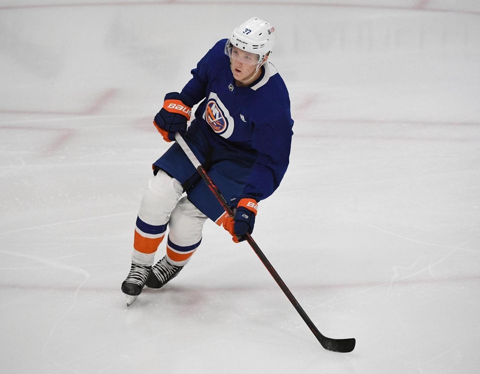 New York Islanders' Simon Holmstrom skates during practice