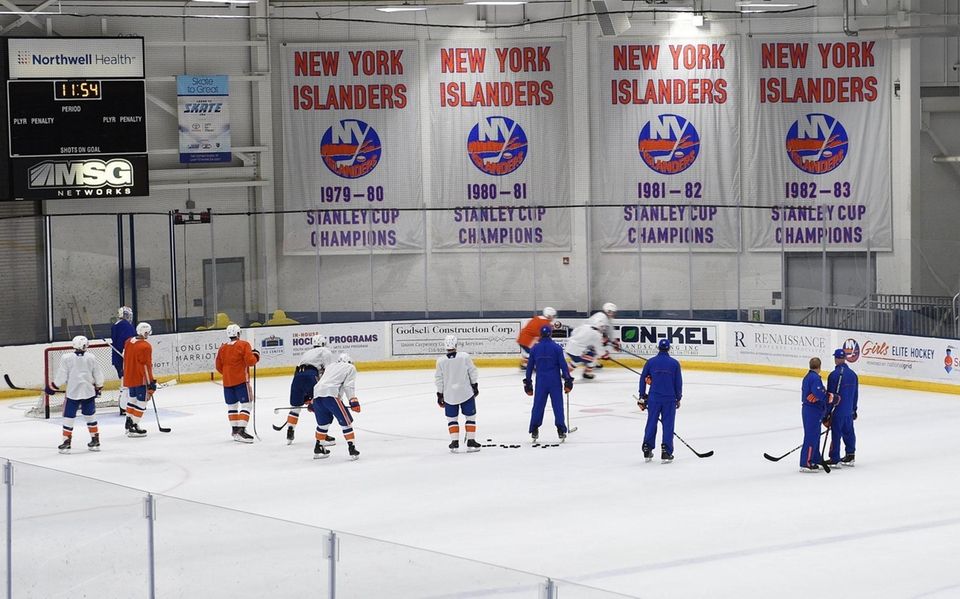 New York Islanders players practice drills during practice