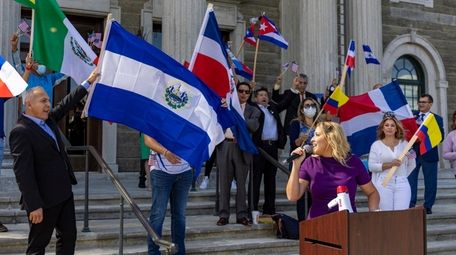 Melissa Figueroa and other Latino activists outside the
