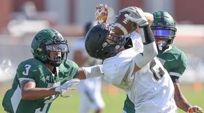 Commack's Tristan McMahon pulls in a touchdown pass