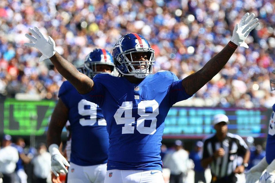 Tae Crowder of the Giants reacts against the
