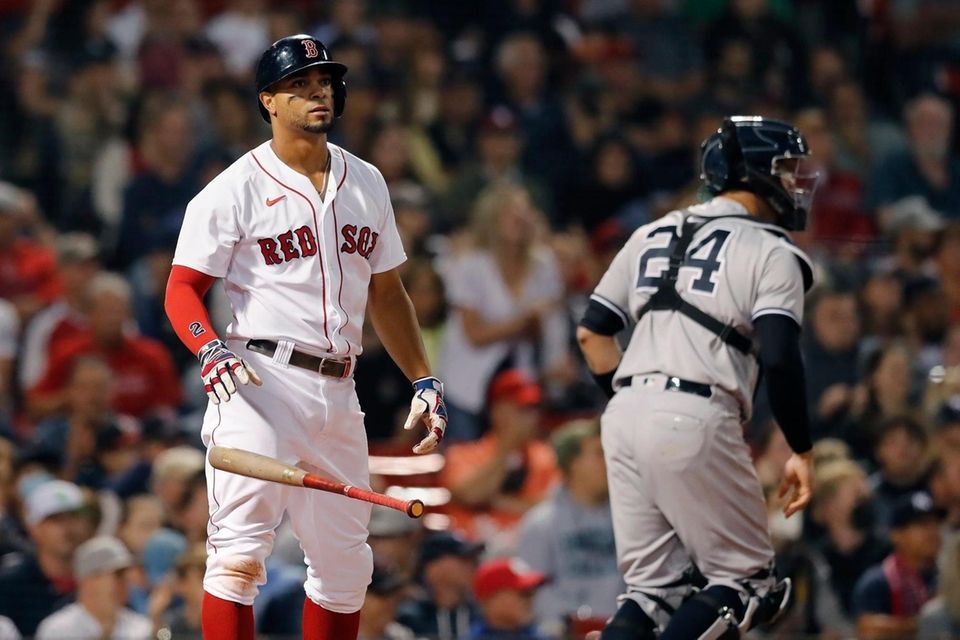 Boston Red Sox's Xander Bogaerts drops the bat