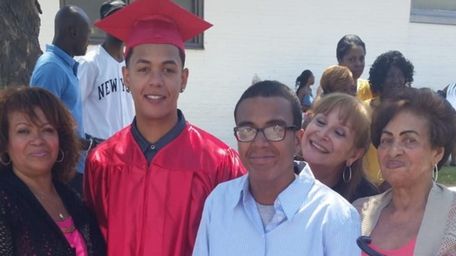 Ramon Garcia with his family during his graduation