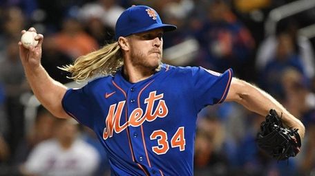 Mets pitcher Noah Syndergaard delivers against the Marlins